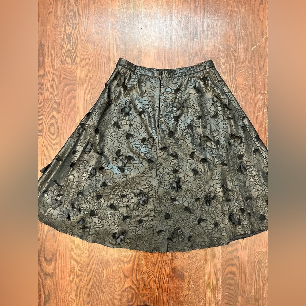 Black faux leather skirt with faux leather flowers